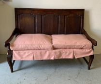 Jointed oak settle, with three back panels, strung seat and cushion on cabriole legs