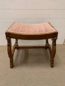 An oak dressing table stool