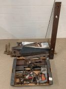 A selection of vintage push me, pull me saws, carpentry tools including plains and hammer drill