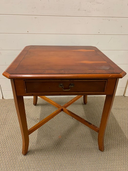 A square side table with drawer to centre