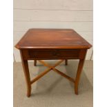 A square side table with drawer to centre