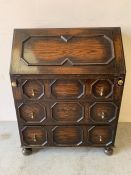 Oak bureau with brass fittings and various pigeon holes under the fall front (H101cm W76cm D43cm)