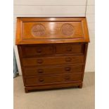 Oriental style bureau with slant front an arrangement of pigeon holes and small drawers inside