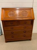 Oriental style bureau with slant front an arrangement of pigeon holes and small drawers inside