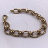 A 9ct yellow gold oval twisted wire effect link bracelet to a trigger clasp. Length 200 mm, width