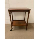 A two tier mahogany trolley