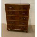 A five drawer chest of drawers (H117cm W87cm D49cm)