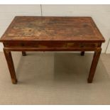 An hardwood Indian desk with two drawers to centre (H84cm W120cm D62cm)