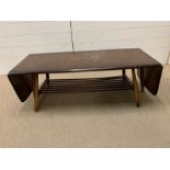 An Ercol Elm coffee table (H36cm W105cm D27cm)