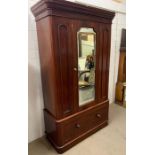 A 1900's mahogany wardrobe with mirror to door and large drawer to base (H203cm W113cm D50cm)