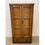 An Arts and Crafts Style Gentleman's wardrobe h 179 cm x W 95 cm x D 46 cm.