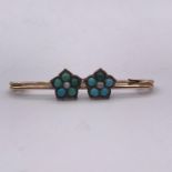 A Turquoise and Persian gold safety pin style brooch (1.5g)