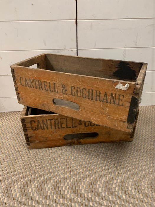 A pair of Cantrell and Cochrane wooden vintage crates