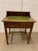 A small writing desk with green leather top and two drawers (H91cm W77cm D60cm)