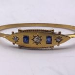 A Gold bangle, marked 15ct with diamonds and sapphires (8g)