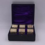 A Boxed set of Six silver plated numbered napkin rings