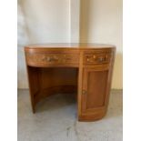 A kidney shape dressing table, inlaid with floral design