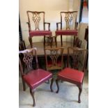 A Victorian mahogany extending dining table with wind out action, carved edged top over a baluster