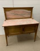 A Pine Two Door Washstand with marble top and framed marble splashback. H 118cm x W 107cm x D 53cm