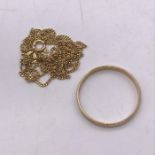 A 9ct gold necklace (2.3g) and 9ct gold wedding band (1.6g)