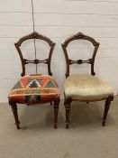 A pair of oak carved dining chairs