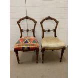 A pair of oak carved dining chairs