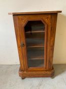 Satinwood cabinet with glazed door and castors with decorated inlay