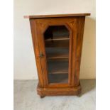 Satinwood cabinet with glazed door and castors with decorated inlay