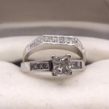 A Wedding ring set of Princess cut 0.6ct engagement ring and half eternity ring on 14ct white gold