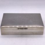 An engraved silver cigarette box, hallmarked Birmingham for Garrard and Co.