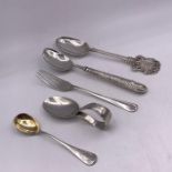 A Selection of five various silver items to include baby spoon, mustard spoon etc.