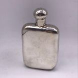 A small silver hip flask by HNN & Co Sheffield 1925 hallmark