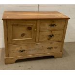 A pine two over one chest of drawers with a cupboard to side of drawers (H78cm W102cm D47cm)