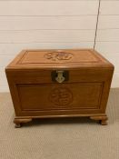 Camphor wood chest with Chinese detail to lid and side. L75cm W50cm H56cm