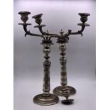 A Pair of silver plated candlesticks