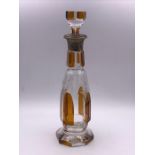A Cut glass decanter with a silver neck
