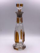 A Cut glass decanter with a silver neck