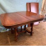 A square dining table with two centre leaves on carved legs (W108cm D105cm) (Each leaf W46cm)