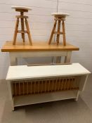 Breakfast bar table with oak top and painted base, two revolving stools and wall hanging plate