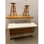 Breakfast bar table with oak top and painted base, two revolving stools and wall hanging plate