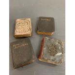 Four miniatures prayer books and hymns, two with silver fronts (5.5cm x 5cm)