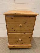 A two drawer pine filing cabinet (H84cm W53cm D45cm)