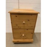 A two drawer pine filing cabinet (H84cm W53cm D45cm)