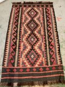 A black and red woven rug/carpet (176cm x 100cm)