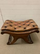 A mahogany leather upholstered foot stool with turned stretchers (H45cm W69cm D45cm)