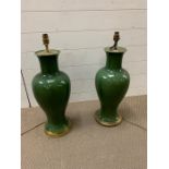 A pair of large emerald green crackle glaze table lamps of baluster form on gilt mounts and fitted