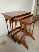 A set of three veneered nesting tables