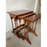 A set of three veneered nesting tables