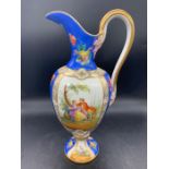 An "Old Paris" porcelain ewer, the body with panels depicting gallant scenes, a blue ground