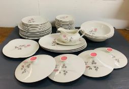 A Royal Doulton dinner service in the Pillar Rose pattern. To include: Four serving tureens with